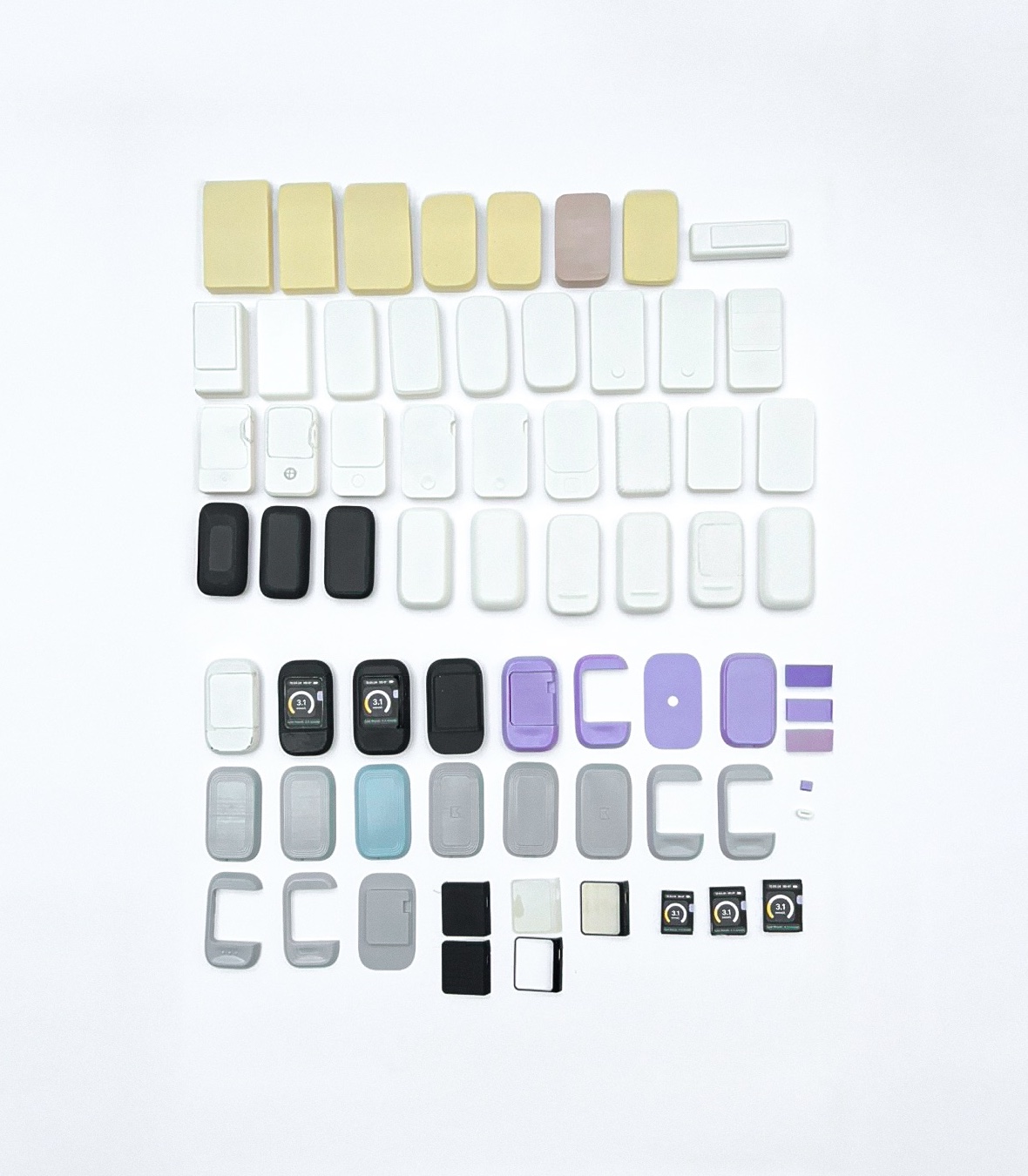 A grid of around sixty foam, resin and 3D-printed prototype models, showing how the device form evolved.
