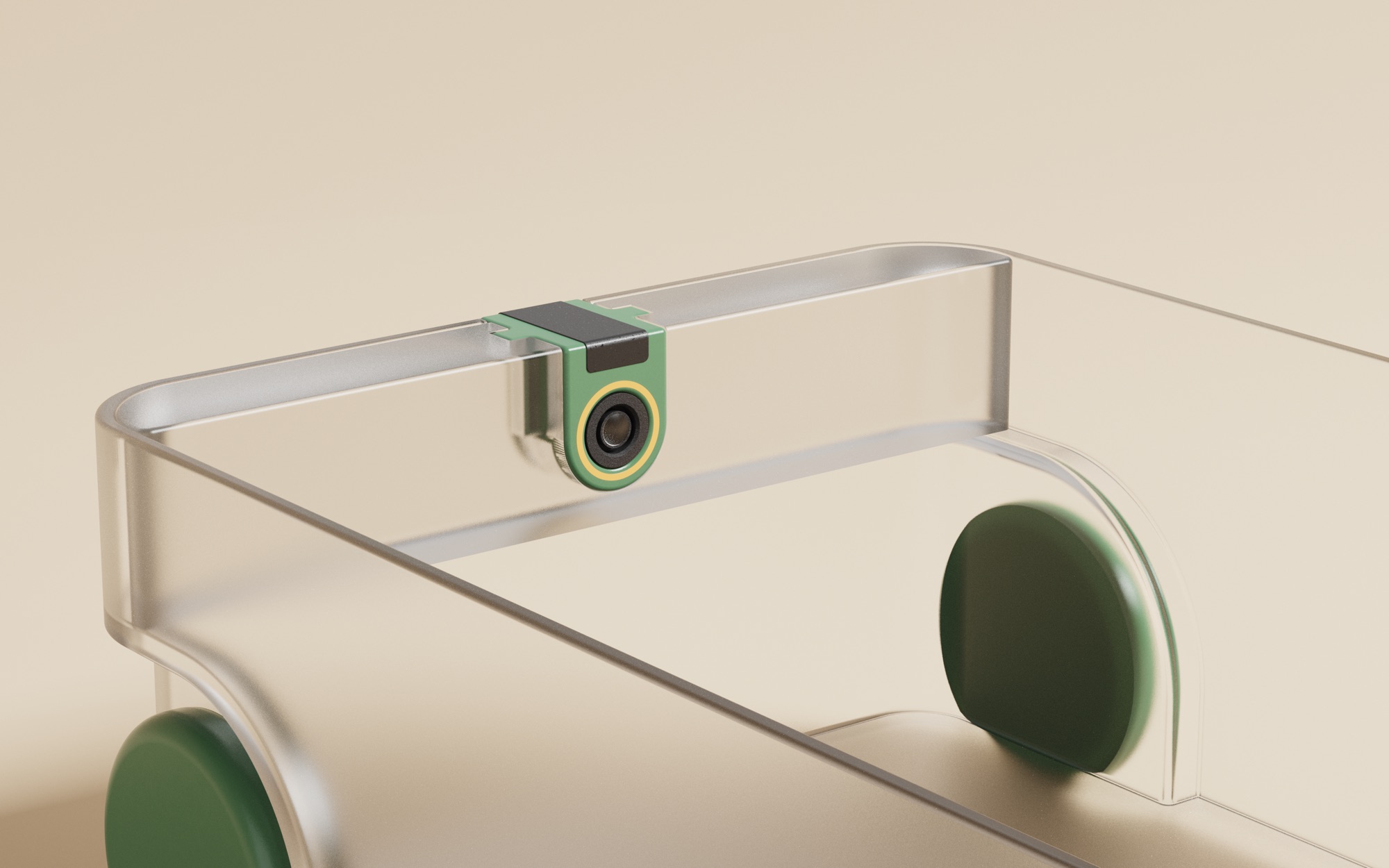 Close-up render of TrackTray: a clear fridge tray with a small green clip-on camera on its rim and green wheels.